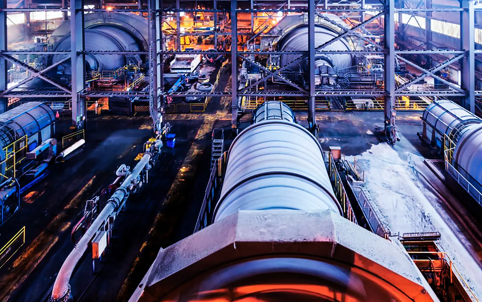 Large-scale SAG and ball mill grinding circuit inside a copper concentrator mining facility.