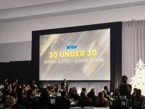 Audience seated at formal ISM event with large screen displaying “30 Under 30 Rising Supply Chain Stars”
