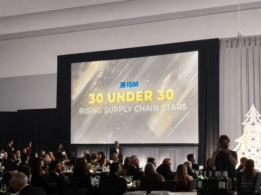 Audience seated at formal ISM event with large screen displaying “30 Under 30 Rising Supply Chain Stars”