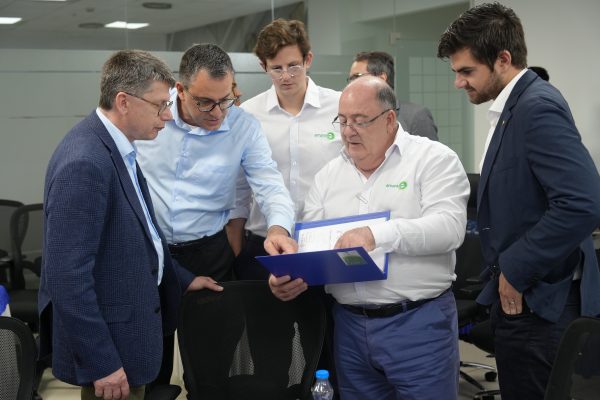 Alejandro Pardiñas Jr. reviewing technical documentation with ZF Wind Power representatives.