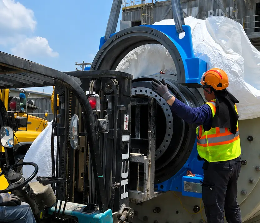 Upper half of an ACB split bearing housing being positioned during cement mill installation