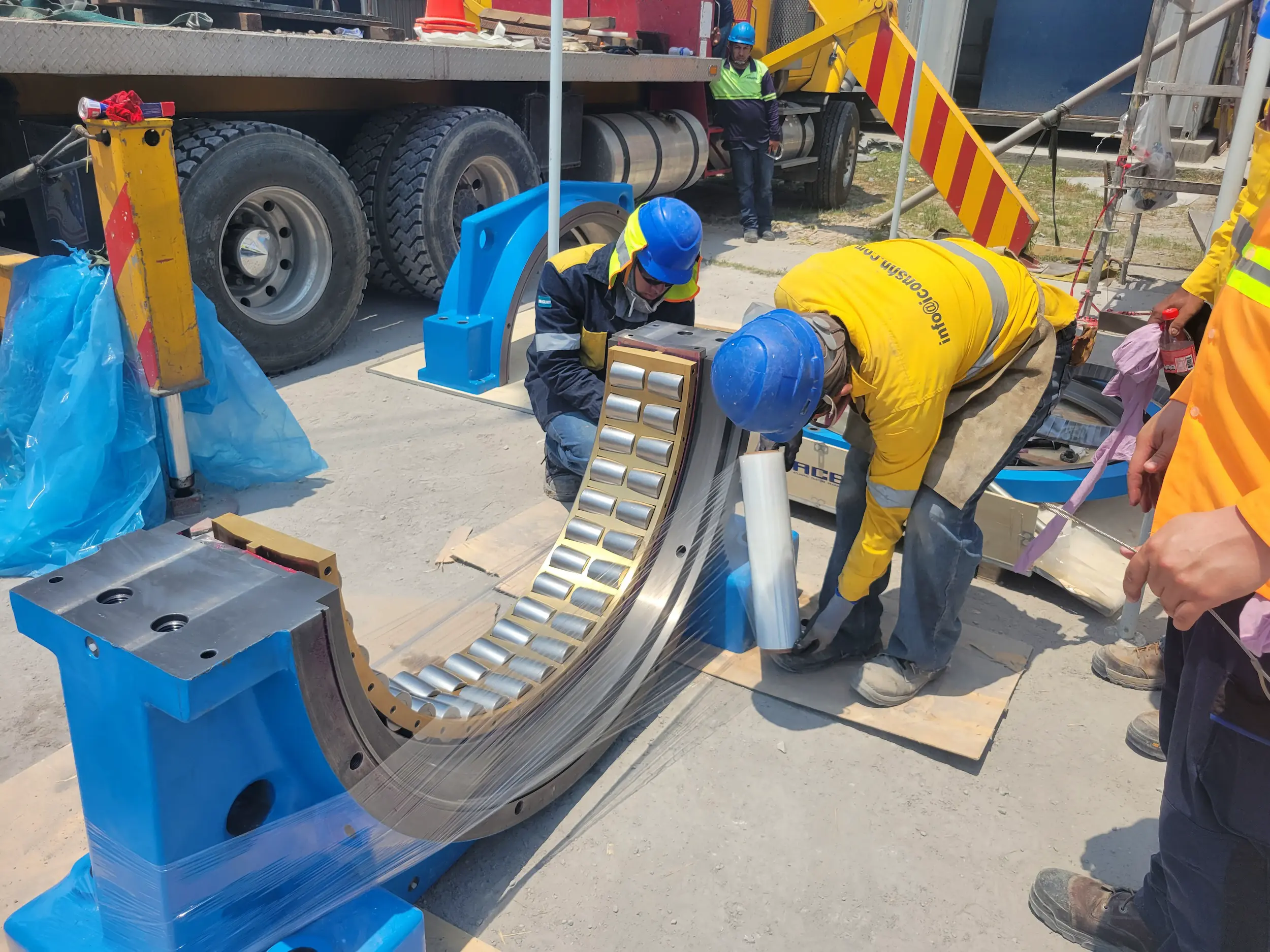 ABS technicians assembling split bearing components and custom housing for a cement mill