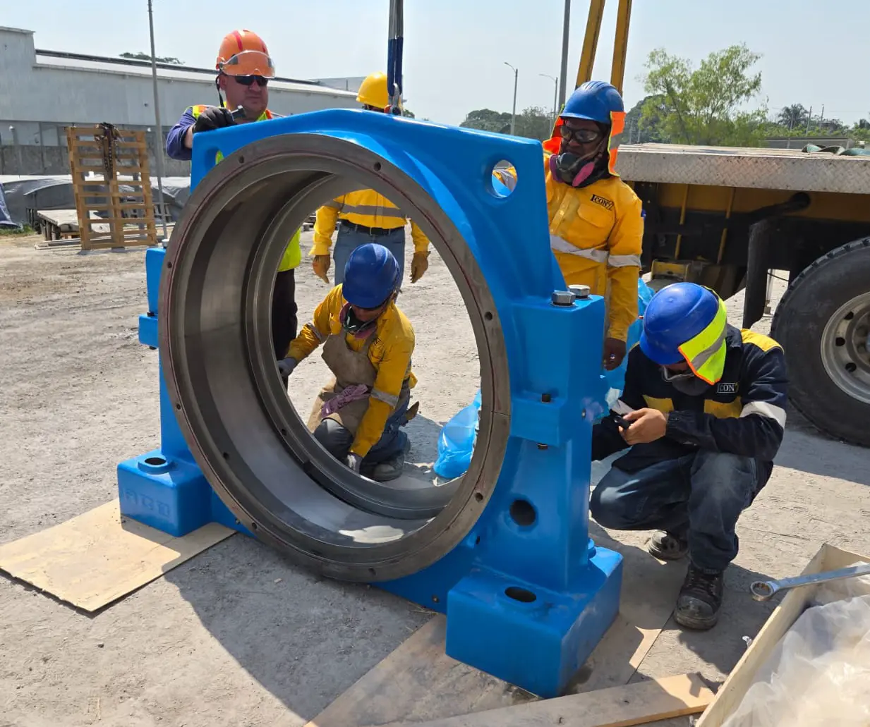 Technicians preparing an ACB custom split bearing housing for cement mill installation