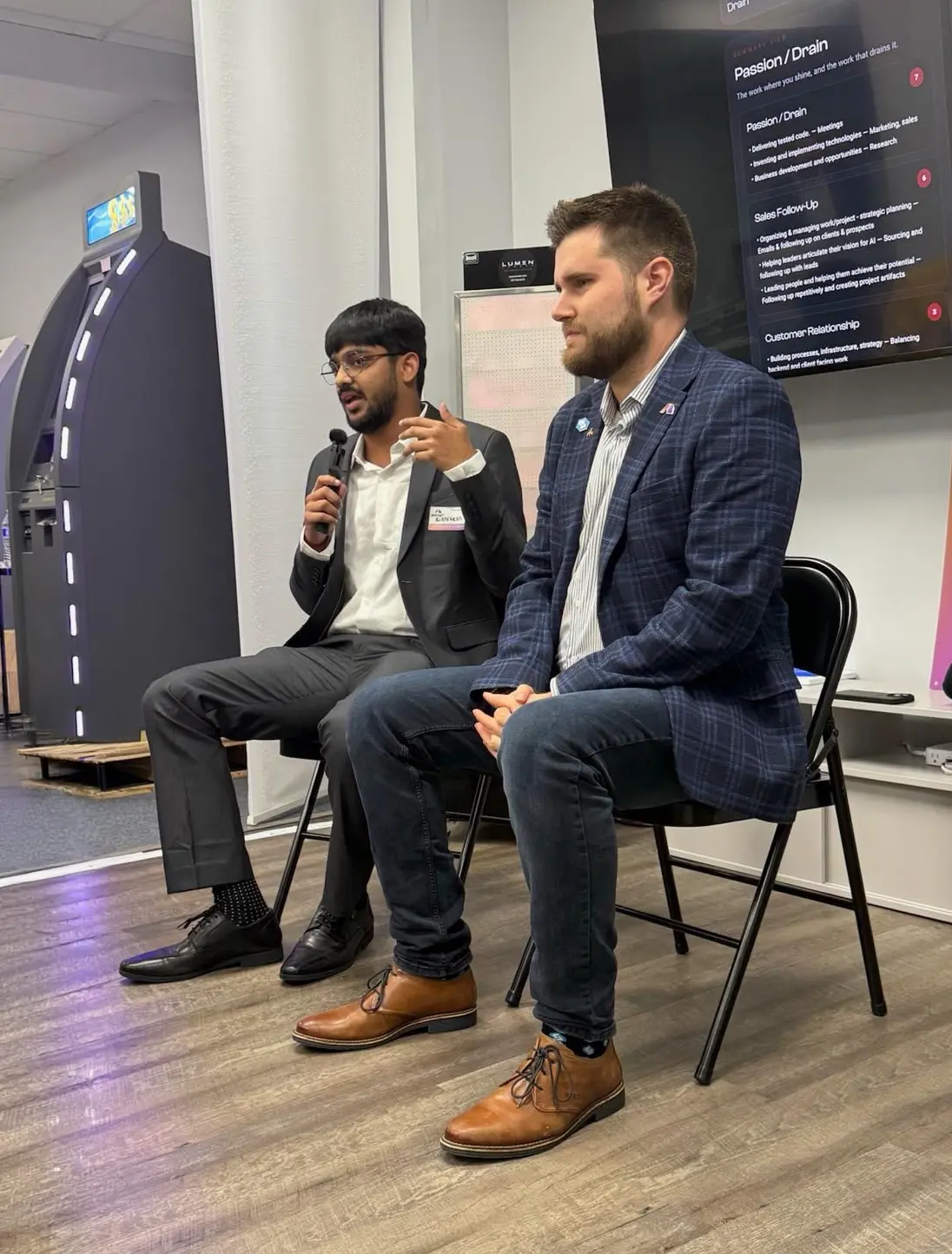 Rishikesh Sivakumar of ABS and David Hartmann discussing AI agents at AI Uncorked in Boca Raton.