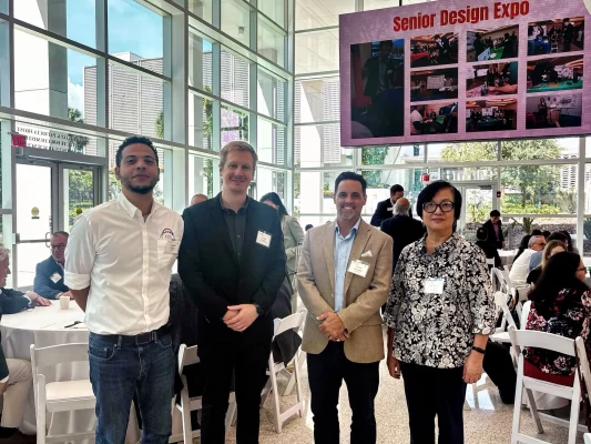 Atlantic Bearing Services (ABS) representatives with faculty and industry members at the University of Miami College of Engineering Senior Design Expo.